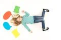 The cute girl gesture on the floor near the dialog signs. View from above Photo
