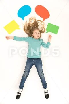 The cute girl gesture near the dialog signs. View from above Stock Photos