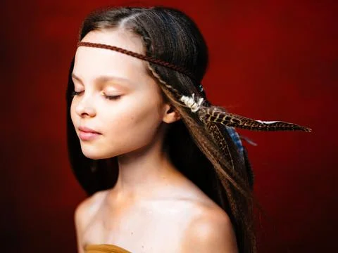 Cute girl hairstyle Apache ethnicity red background Stock Photos