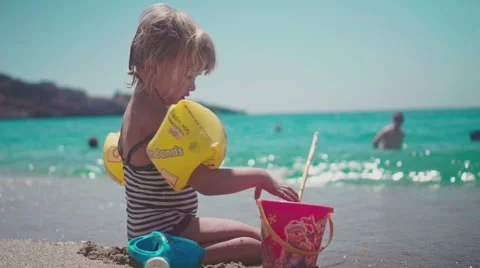 Cute Girl Having Fun on Beach and Playing with Sand Video stock 60384146