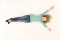 The cute girl lay on the floor. View from above Photo
