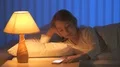 The cute girl phone on the bed. Evening night time 4k or 4k+ Resolution