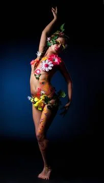 Cute girl posing with patterns and flowers on body Cute girl posing with p... Stock Photos