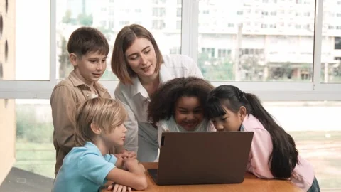 Cute girl programing system while surround with teacher and friend. Erudition. Stock Footage 262819576