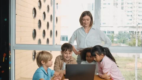 Cute girl programing system while surround with teacher and friend. Erudition. Stock Footage 263622061
