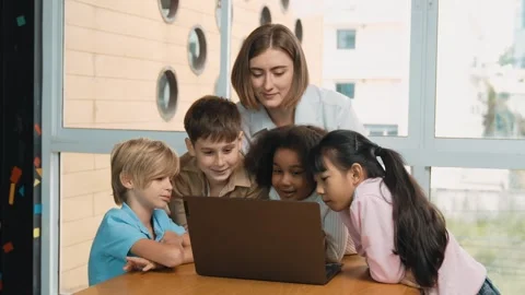 Cute girl programing system while surround with teacher and friend. Erudition. Stock Footage 264636285