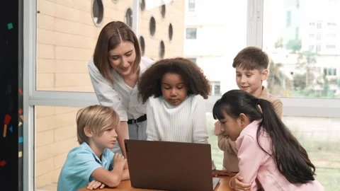 Cute girl programing system while surround with teacher and friend. Erudition. Stock Footage 266064313