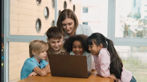 Cute girl programing system while surround with teacher and friend. Erudition. Stock Footage 268340291