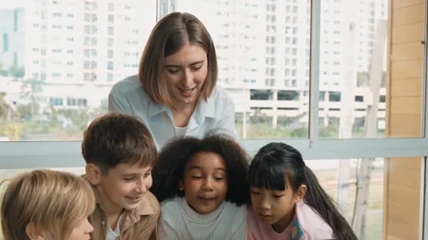 Cute girl programing system while surround with teacher and friend. Erudition. Stock Footage 269125145