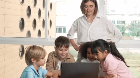 Cute girl programing system while surround with teacher and friend. Erudition. Stock Footage 270207318
