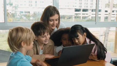 Cute girl programing system while surround with teacher and friend. Erudition. Stock Footage 271080056