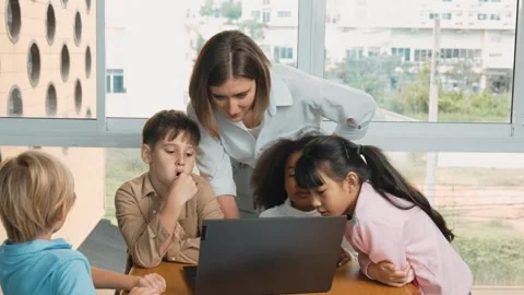Cute girl programing system while surround with teacher and friend. Erudition. Stock Footage 273381845
