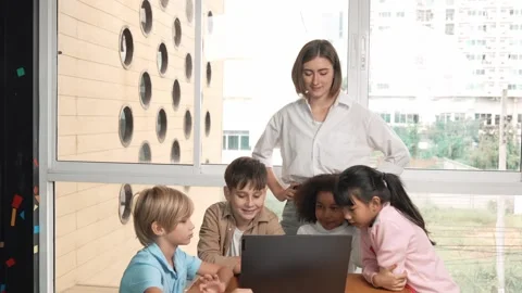 Cute girl programing system while surround with teacher and friend. Erudition. Stock Footage 274700752