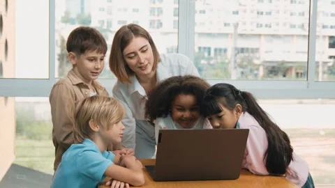Cute girl programing system while surround with teacher and friend. Erudition. Stock Footage 274905346