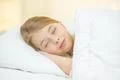 The cute girl sleeping on the bed Photo
