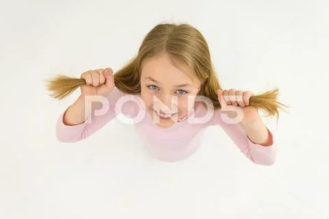 The cute girl smile to the camera. View from above Stock Photos
