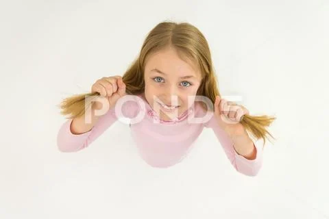 The cute girl smile to the camera. View from above Stock Photos