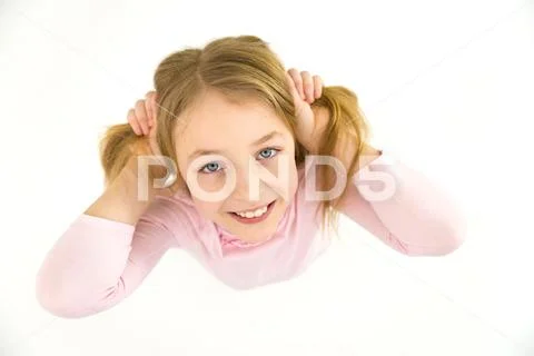 The cute girl smile to the camera. View from above Stock Photos