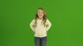 The cute girl smile on the green background 4k or 4k+ Resolution