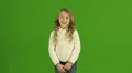 The cute girl smile on the green background 4k or 4k+ Resolution