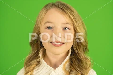 The cute girl smile on the green background. Portrait view Stock Photos