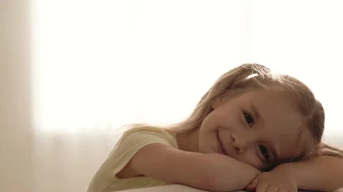 Cute girl smiling at camera while spending time at home, close up portrait Stock Footage 152665208