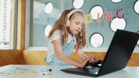 Cute girl turn head while using laptop, coding, computer programing. Erudition. Stock Footage 278689213