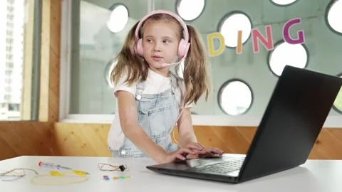 Cute girl turn head while using laptop, coding, computer programing. Erudition. Stock Footage 280599181