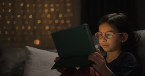 Cute girl is using digital tablet Stock Footage 246484795