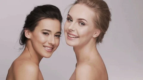 Cute girls posing at studio background Stock Footage 92701751