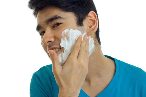Cute guy putting a foam face before shaving Stock Photos
