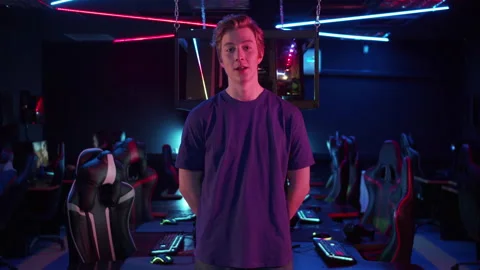 A cute guy streamer leads his live broadcast from the esports arena, a big Stock Footage 152347250