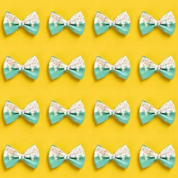 Cute hair bow pattern on bright background, flat lay Stock Photos