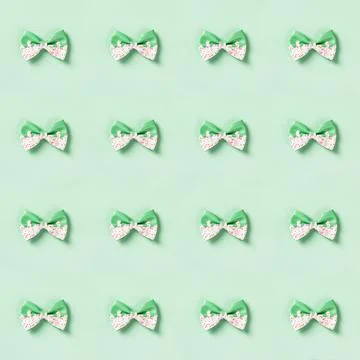 Cute hair bow pattern on bright background, flat lay Stock Photos