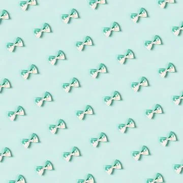 Cute hair bow pattern on bright background, flat lay Stock Photos