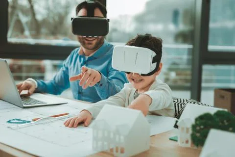 Cute happy boy being in virtual reality glasses Stock Photos