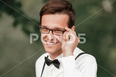 Cute happy bride looking through the glasses. Stock Photos