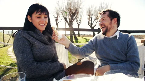 Cute happy couple having brekafast in front of the sea Stock Footage 45756574