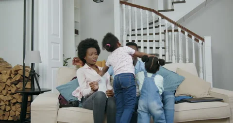 Cute happy smiling black two girls running to their parents which sitting on Stock Footage 144345346