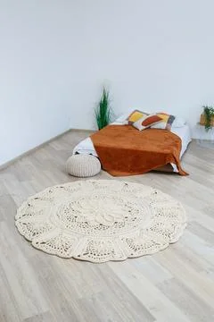 Cute homemade knitted pattern of thick threads made by hand: a handmade rug m 写真素材