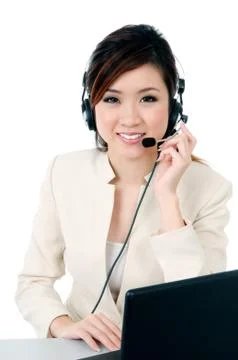 Cute hotline operator with headset Stock Photos