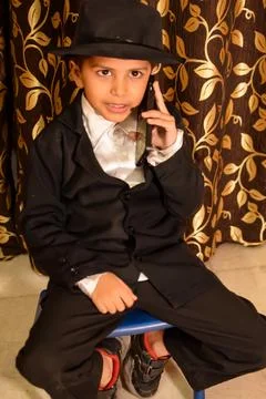 Cute Indian Boy posing with dance step, Asian child model shoot with black .. Foto stock