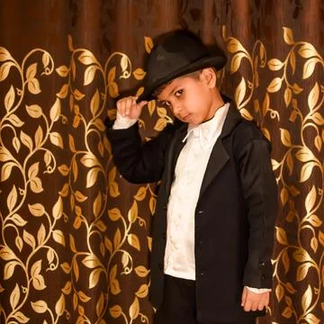Cute Indian Boy posing with dance step, Asian child model shoot with black .. 스톡 사진