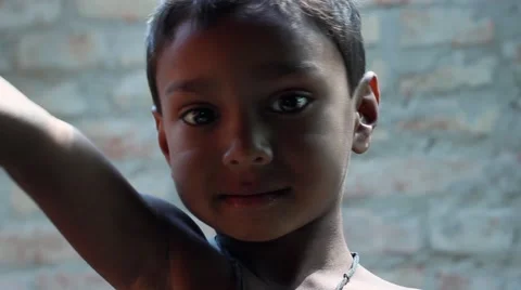 Cute Indian village boy eats and plays Stock Footage 49910144