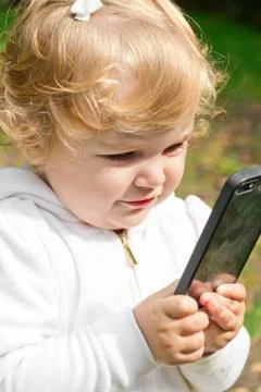 Cute infant with cellular Stock Photos