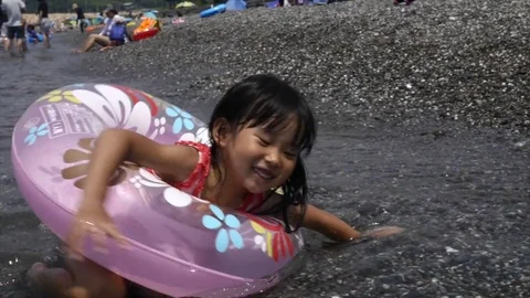 Cute Japanese girl playing at the Stock Video Pond5