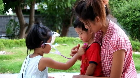Cute kid act as doctor cure brother and mother Stock-Footage 53286853