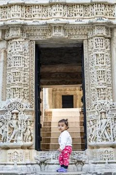 Cute kid at ancient unique temple entrance with white marble unique archite.. 스톡 사진