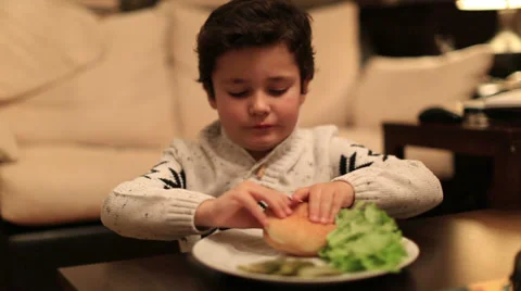 Cute kid bite delicious hamburger Stock Footage 34351106