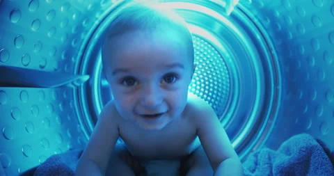 Cute Kid Boy Having Fun at Home Inside Washing Machine. Funny Life or Dream of Stock Footage 148054224